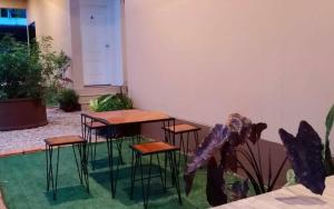 a group of tables and stools in a room at Arawan Resort เอราวัณ รีสอร์ท in Ngao