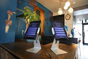 two cell phones on display on a table at Hotel 385 in Miyako Island