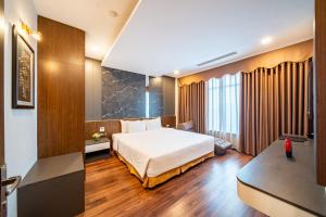 Postel nebo postele na pokoji v ubytování Muong Thanh Grand Hanoi Hotel