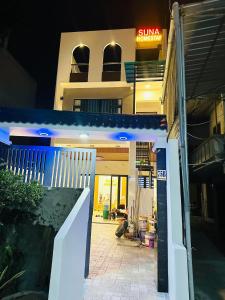 an entrance to a building with a sun sign on it at Homestay SUNA in Tuy Hoa