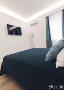 Ένα ή περισσότερα κρεβάτια σε δωμάτιο στο Giuliana +23 φωτογραφίες