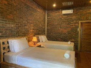Letto o letti in una camera di Mayong Bali Villa and Hostel