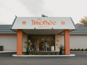 a store front with people standing outside of it at The Timothée Resort in Busselton