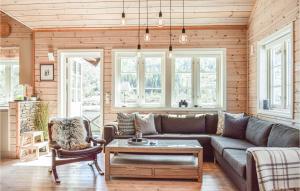 a living room with a couch and a table at Tokagjelet in Norheimsund