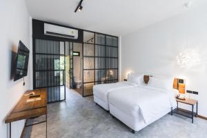 Letto o letti in una camera di Baan Ploy Sea