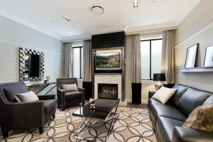 a living room with a couch and a fireplace at Family Retreat In Top Blue Mountains Location in Katoomba