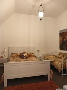 Postel nebo postele na pokoji v ubytování Old Colony Inn
