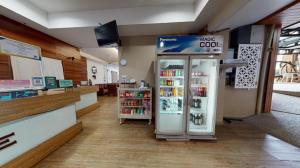 a grocery store with a refrigerator in a store at Changsova Hotel in Ban Chang