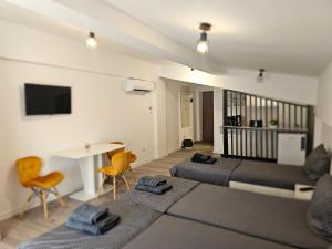 TV a/nebo společenská místnost v ubytování DIDI Apartament