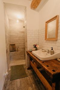 a bathroom with a white sink and a shower at Zlatorudná chalupa in Bruntál +52 photos