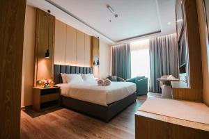 Postel nebo postele na pokoji v ubytování Frankincense Hotel Muscat فندق اللبان مسقط + 37 fotografií