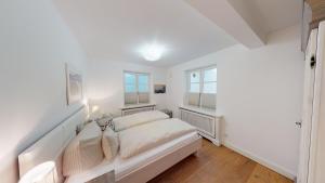 En eller flere senge i et værelse på Landhaus Strandhafer HT 2
