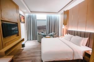 Postel nebo postele na pokoji v ubytování Frankincense Hotel Muscat فندق اللبان مسقط