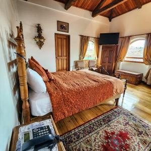 Postel nebo postele na pokoji v ubytování Hotel Boutique Casa San Marcos