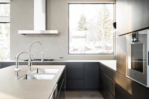a kitchen with a sink and a large window at Hiiragi by H2 Life in Niseko +7 photos