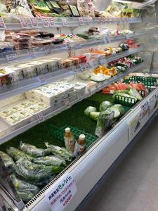a produce section of a store filled with vegetables at HOTEL KANALOA in Tokashiki