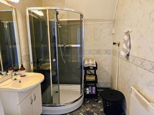 a bathroom with a shower and a sink at Leilighet i Svolvær sentrum in Svolvær +14 photos