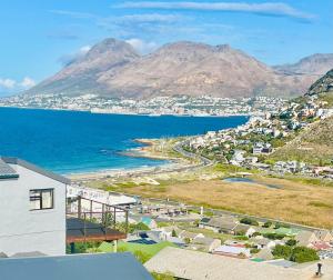 a view of a city and the ocean with mountains at Sunset Haven Ocean, Mountain & Valley Views in Cape Town