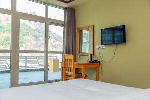 TV a/nebo společenská místnost v ubytování Hotel Gyan Gauri Palace