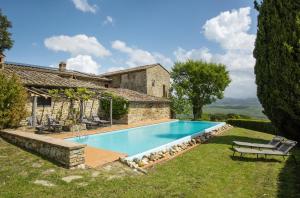 an external view of a house with a swimming pool at Private Chianti Hill Residence in Vagliagli