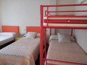 Ένα ή περισσότερα κρεβάτια σε δωμάτιο στο Sentir Galicia Apartamentos