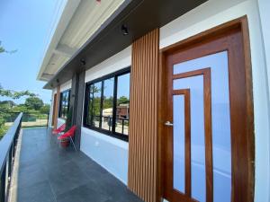 a door on the balcony of a house at AMV Hotel, Events Place & Restaurant in Mamburao +20 photos