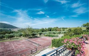 a view of a tennis court from a balcony at 2 Bedroom Lovely Home In Trequanda Si in Trequanda