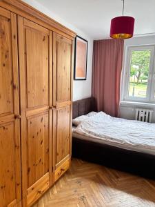 Posteľ alebo postele v izbe v ubytovaní Apartament centrum Szczytno Mazury