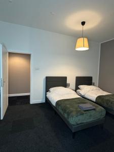 Ένα ή περισσότερα κρεβάτια σε δωμάτιο στο N&L Apartments +6 φωτογραφίες