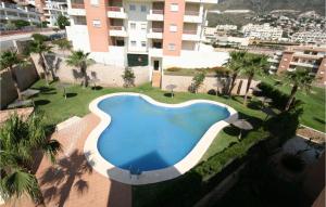 an overhead view of a swimming pool in a resort at Nice Apartment In Benalmádena Costa in Benalmádena