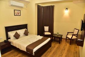 Voodi või voodid majutusasutuse SAK Royal Residency 2 kms from Mysore Palace toas