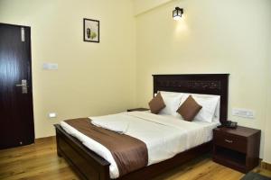 Voodi või voodid majutusasutuse SAK Royal Residency 2 kms from Mysore Palace toas