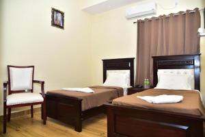 Voodi või voodid majutusasutuse SAK Royal Residency 2 kms from Mysore Palace toas