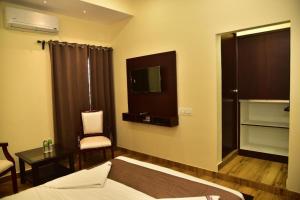 Voodi või voodid majutusasutuse SAK Royal Residency 2 kms from Mysore Palace toas