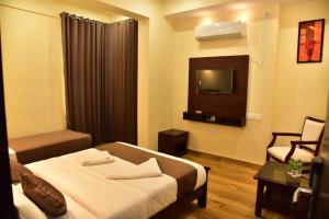 Voodi või voodid majutusasutuse SAK Royal Residency 2 kms from Mysore Palace toas