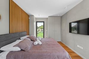 Ein Bett oder Betten in einem Zimmer der Unterkunft Lazy Olive