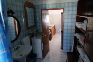 a bathroom with a sink and a mirror at Stanza a Formentera in Sant Ferran de Ses Roques