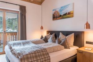 Letto o letti in una camera di Schartneralm Kiefer Family