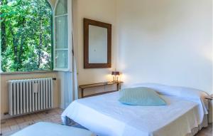 A bed or beds in a room at 5 Bedroom Amazing Home In Grottaferrata