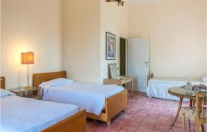A bed or beds in a room at 5 Bedroom Amazing Home In Grottaferrata