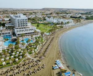 an aerial view of a resort and the beach at Golden Bay Beach Hotel in Larnaca