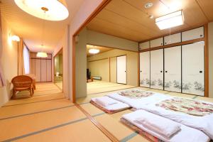 Voodi või voodid majutusasutuse Hotel Yudanaka toas