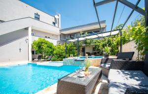 an image of a house with a swimming pool at Beautiful Home In Brodarica With Wifi in Brodarica +27 photos