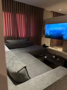 Televisyen dan/atau pusat hiburan di Apartament 22 +20 gambar