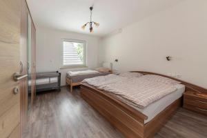 Postel nebo postele na pokoji v ubytování Apartmaji Seljak + 16 fotografií