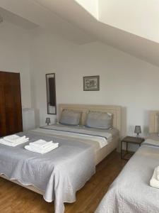 Postel nebo postele na pokoji v ubytování Hotel Cité
