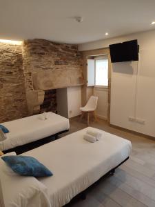 Кровать или кровати в номере Pensión SP 55 by Bossh! Hotels