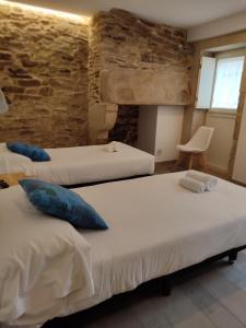 Кровать или кровати в номере Pensión SP 55 by Bossh! Hotels