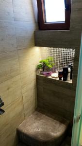 a small bathroom with a bench and some plants at Marios House in Kini +22 photos
