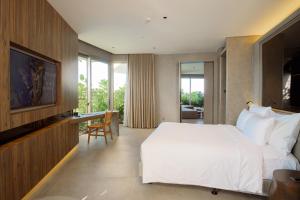 Ένα ή περισσότερα κρεβάτια σε δωμάτιο στο M Hotel Danang